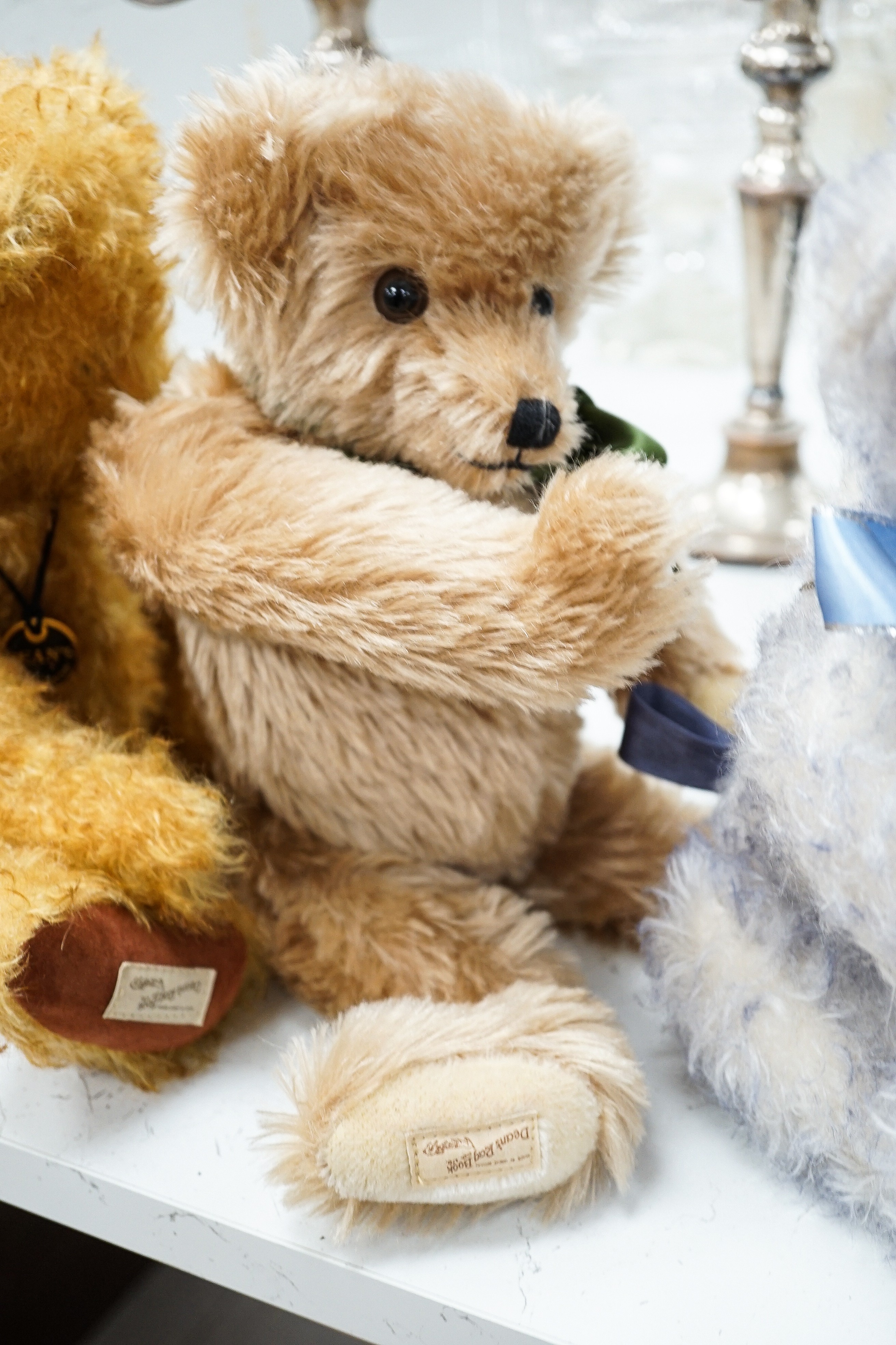 Four Deans teddy bears, a Steiff teddy and a Hermann teddy, Steiff bear, 39 cms high.